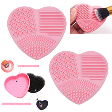 Heart shaped makeup brush cleaning tool in pink